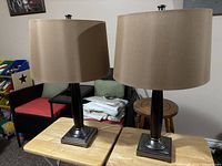 Both matching lamps side by side on tables showing shades, columns, bases