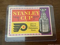 Front of 1973-74 O-Pee-Chee Stanley Cup Winner Flyers card in top loader