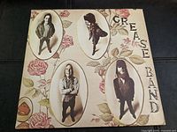 Front cover showing floral design and band member images