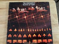 Front cover of Basket of Light LP showing artwork