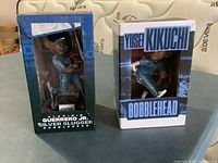 Front view of both sealed bobblehead boxes