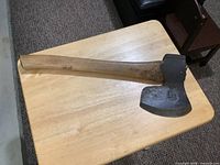 Full view of axe showing head and entire handle