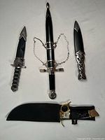 All four daggers with their sheaths displayed