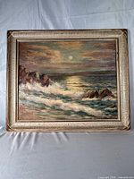 Frontal view of framed seascape painting