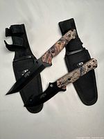 Both knives seated in their sheaths showing overall design and pair