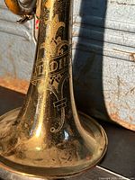 Close-up of bell engraving and brass finish