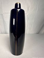 Full front view showing cobalt glaze and vertical gold line