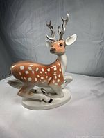 front three-quarter view showing glaze, color, antlers