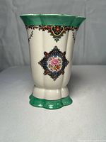 Front view of Noritake vase showing floral medallion, green accents