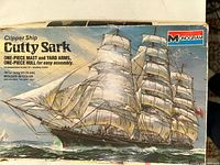 Front box art showing painting of Cutty Sark and Monogram logo