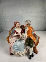 Front view showing courting couple figurine details