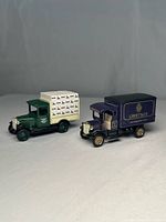 Both die-cast trucks side by side