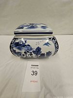 Front view of Blue Willow porcelain lidded jar