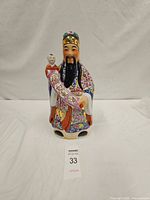 Front view of Fuxing ceramic figurine with child