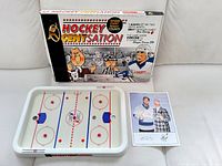 Box front, rink board, instruction photo displayed together