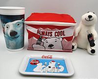 Group view of all four Coca-Cola polar bear items