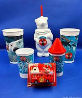 Front view of all Coca-Cola cups and bus package