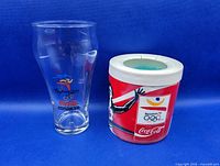 Both Coca-Cola Olympic items side by side