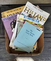 Box showing multiple songbooks and sheet music titles