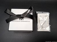 Boxed Katherine Karambelas jewelry set sealed in packaging