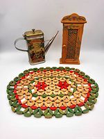 Overview of all three items: trivet, oil can, wall cabinet