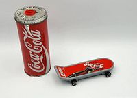 Pencil sharpener and toy skateboard side by side