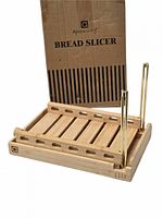 Slicer assembled showing bamboo slotted base, gold guide rods and branded box