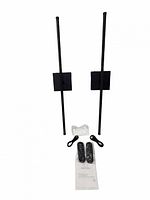 Two black wall sconces with remotes, cables and manual displayed