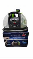 Bissell Little Green cleaner on retail box showing hose, tanks and stain tool