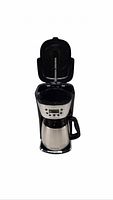 Coffee maker with lid open showing brew basket and stainless steel thermal carafe