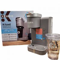 Coffee maker front view with box and tumbler