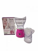 Steamer base with full-face mask attached, nasal mask attachment beside, retail box in background