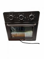 Front view of Our Place Wonder Oven with controls and door closed