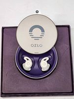 Ozlo Sleepbuds in charging case inside box