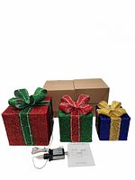 Three assembled glitter LED gift boxes, two sealed cartons, power adapter, instructions visible