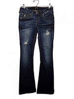 Front view of dark indigo True Religion flare jeans showing distressing and flare cut