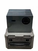 Front view of projector on molded carry case