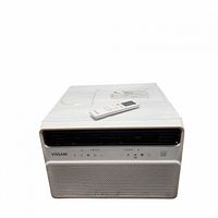 Front and top view of Vissani portable air conditioner with remote placed on top