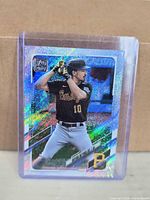 Front view of Bryan Reynolds Topps 70 Years rainbow foil card in sleeve