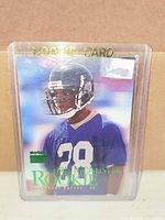 Front of Chris McAlister rookie card in plastic holder showing player image, SkyBox logo and Rookie text