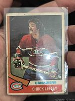 Front view of Chuck Lefley hockey card showing player image, team logo and name