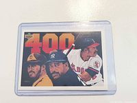 Front view of Upper Deck baseball card with large 400 and three player portraits