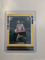 Front view of AJ Johnson NBA Hoops rookie card in sleeve