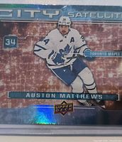 Front of Upper Deck City Satellites Auston Matthews card showing holographic design