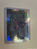 Front of Artemi Panarin City Satellites holographic trading card in top loader