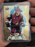 Front view of holographic Clayton Keller ICE card in top loader