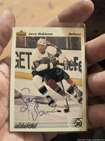 Front of Larry Robinson Upper Deck card with blue ink autograph