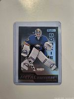 Front view of Skybox Metal Universe Devon Levi rookie card in plastic holder