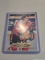 Front view of Fleer Ultra Theoren Fleury hockey card in holder