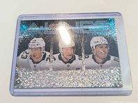 Front of card showing holographic fleck finish and player images